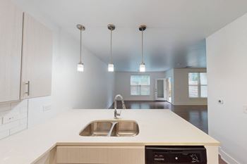Modern upscale finishes with chrome lighting and fixtures at The Whit Apartments off of Mass Ave in Downtown Indianapolis, IN 46204